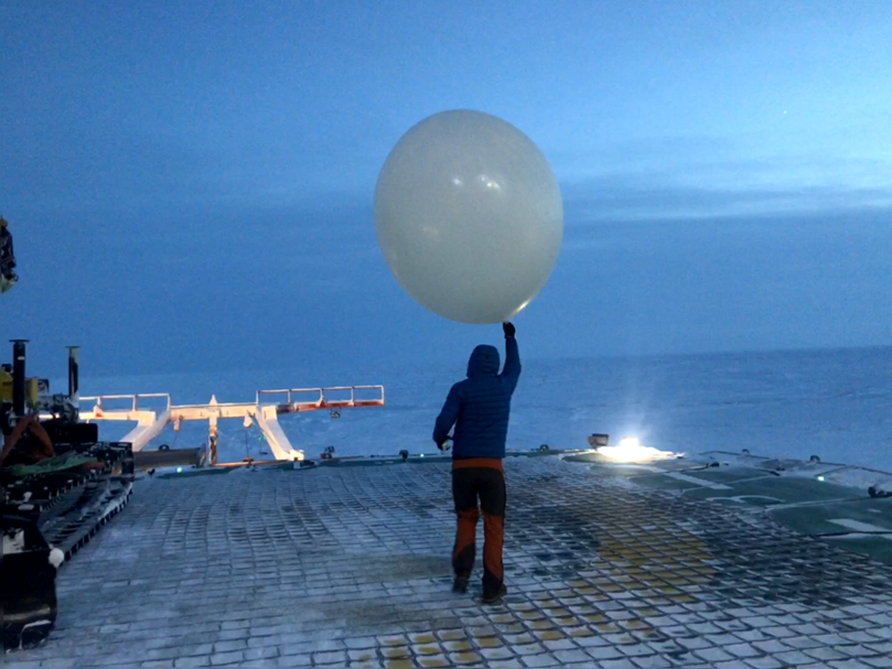 John Bilberry launches a weather balloon during MOSAiC