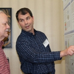 Dave Turner sharing information about his poster to Ashley Williamson, DOE Program Manager for Atmospheric System Research at the 2015 Science Team Meeting.