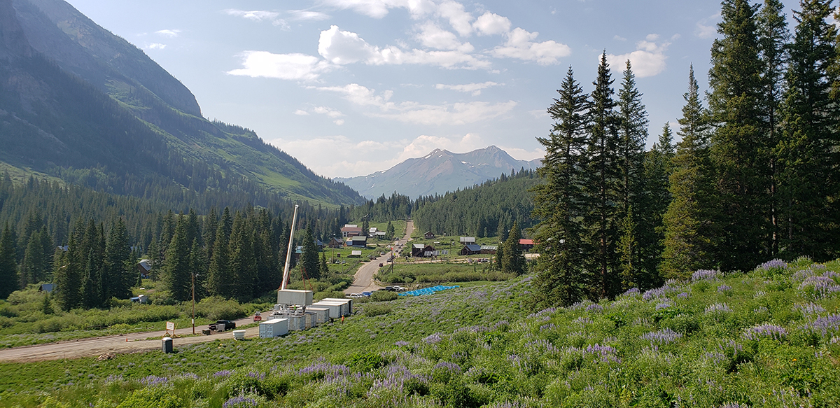 A crane lifts an ARM Mobile Facility container during site construction at Gothic Townsite, Colorado, for the SAIL campaign