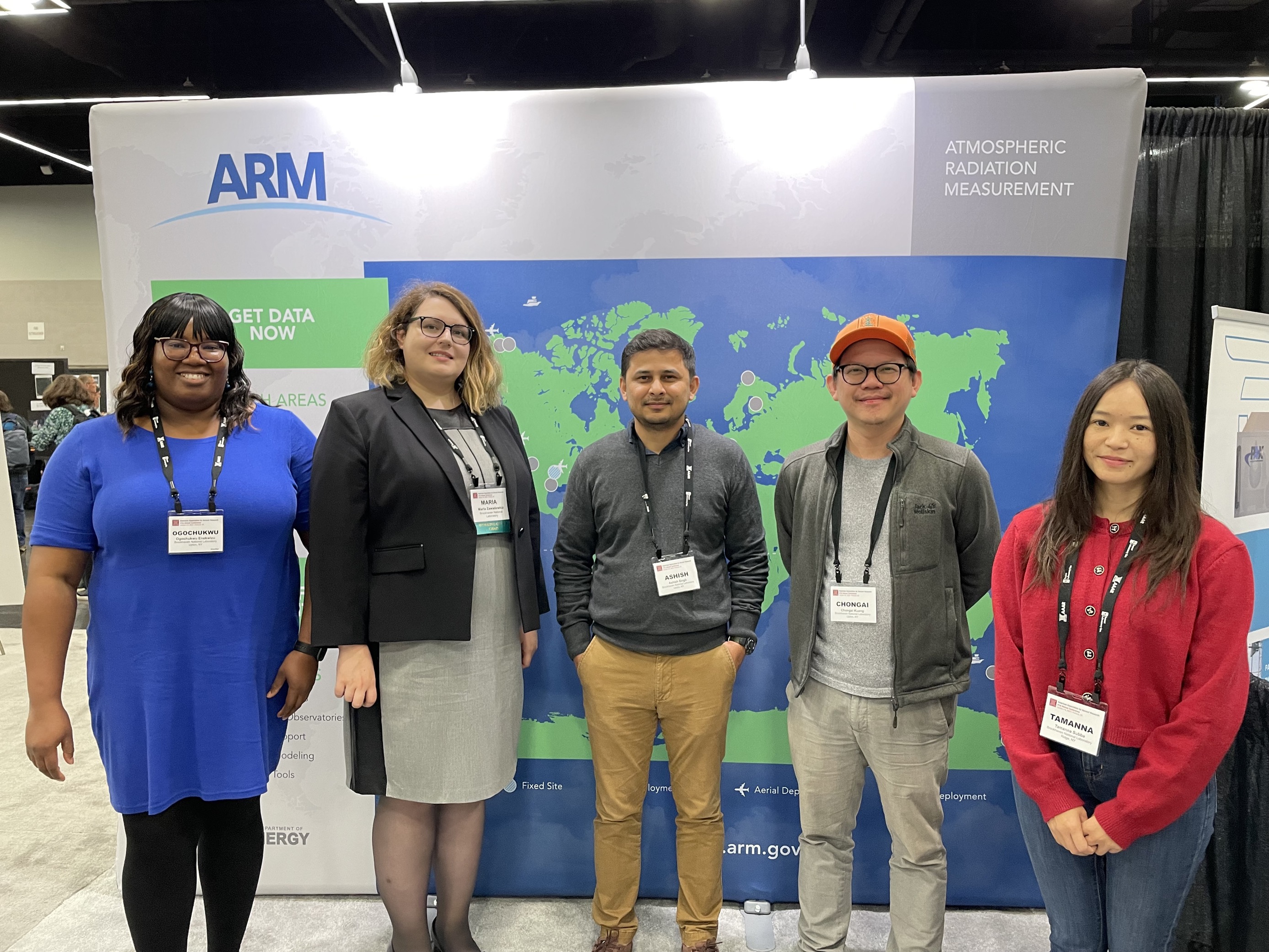 Atmospheric scientists from Brookhaven National Laboratory pose for a group photo at the ARM booth during the 41st annual conference of the American Association for Aerosol Research (AAAR) in Portland, Oregon.