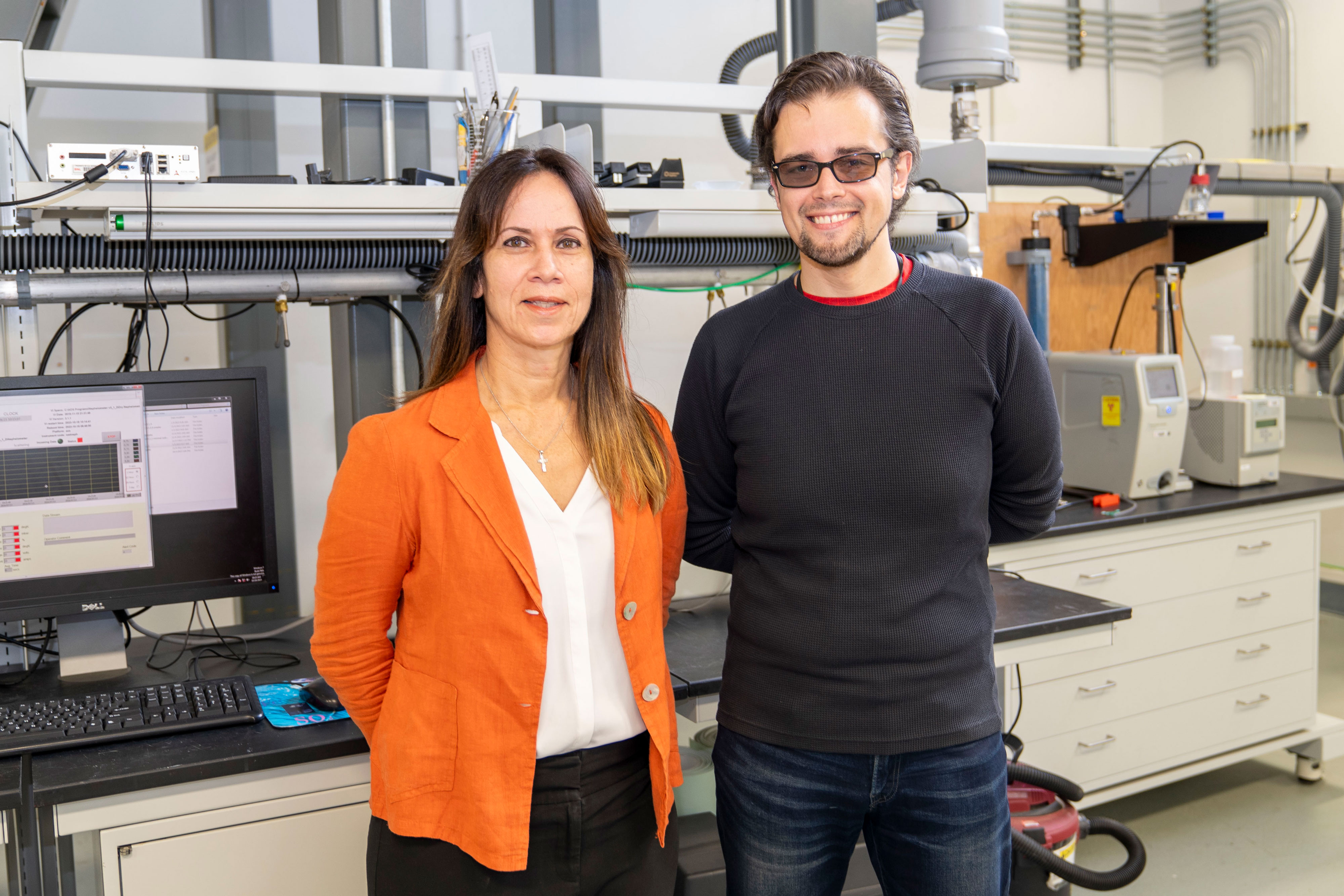Olga Mayol-Bracero and Janek Uin stand together in a lab.