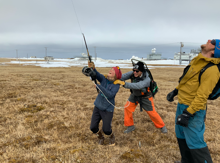 Research assistants launch a weather balloon at ARM's North Slope of Alaska atmospheric observatory