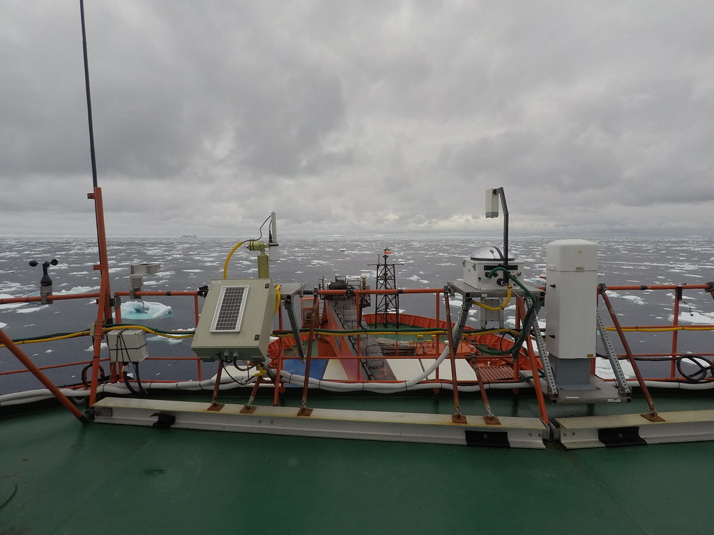 Ice chunks float in the Southern Ocean as ARM instruments collect data from a ship deck. ARM file. 