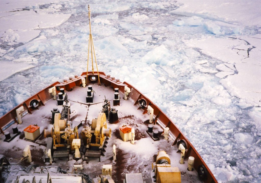 An aerial view of the front of the ship Des Groseilliers breaking through arctic ice