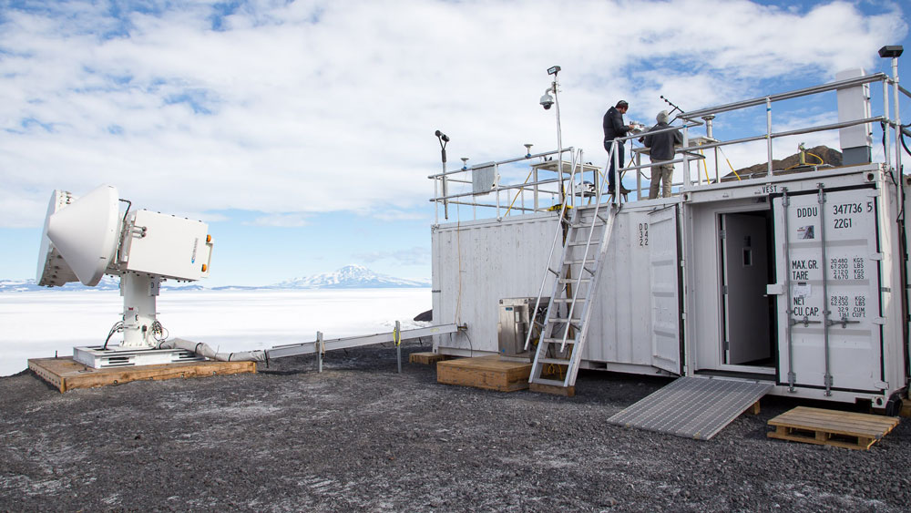 People work on top of an ARM Mobile Facility during installation for the AWARE campaign in Antarctica.