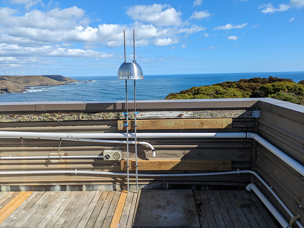 An ice-nucleating particle sampler, protected by a salad bowl shield, overlooks the Southern Ocean.