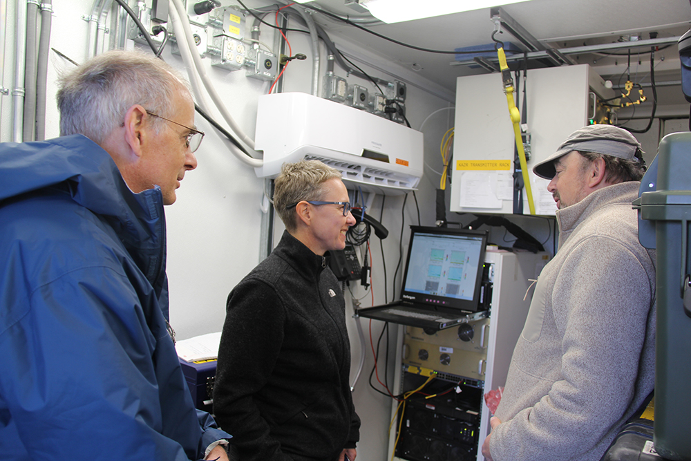 Inside an ARM Mobile Facility instrument container, CAPE-k Co-Principal Investigator Jay Mace (right) talks with ARM Director Jim Mather (left) and Elanor Huntington, a CSIRO executive director, during a CAPE-k site tour in April 2024. Photo is by Sophie Schmidt, CSIRO.