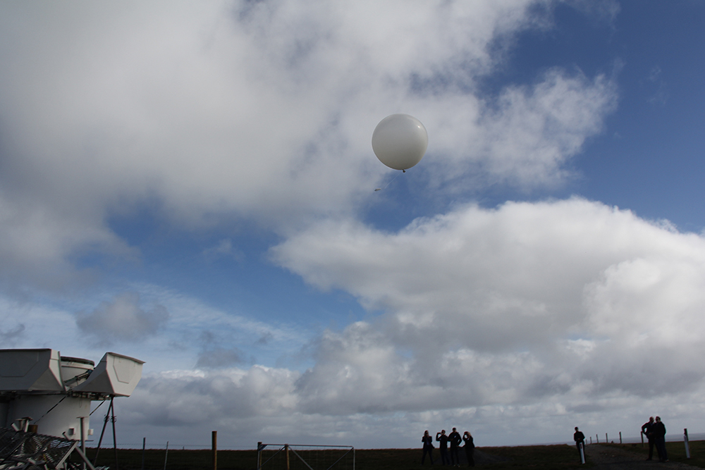 CAPE-k site visitors check out a weather balloon released from BOM’s automated radiosonde launcher (bottom left). Photo is by Sophie Schmidt, CSIRO. 