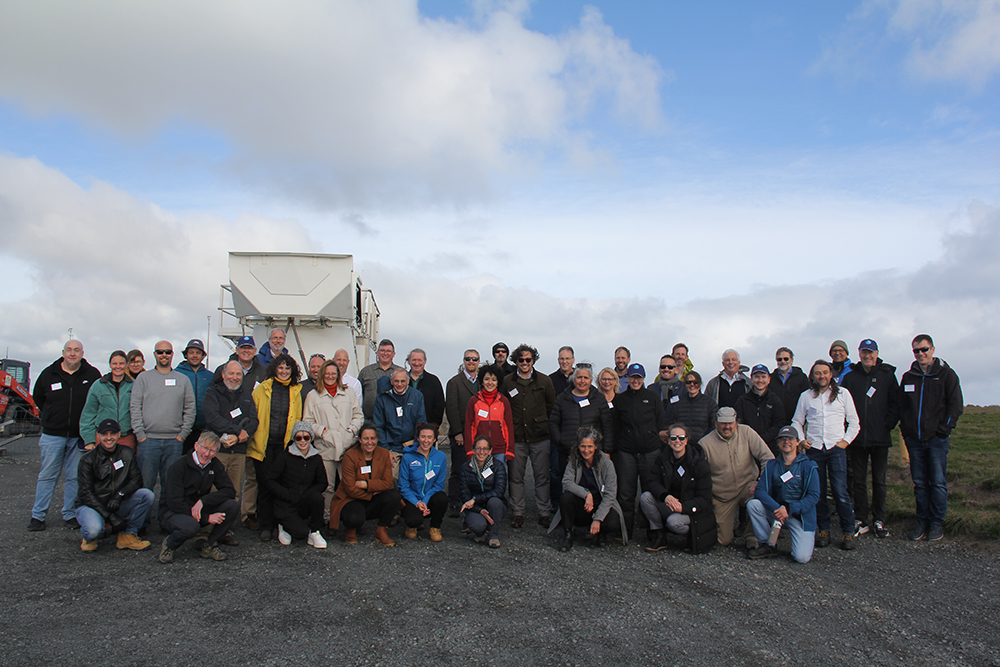 CAPE-k site visitors and staff gather for a photo in front of the autosonde launcher. Photo is by Sophie Schmidt, CSIRO.