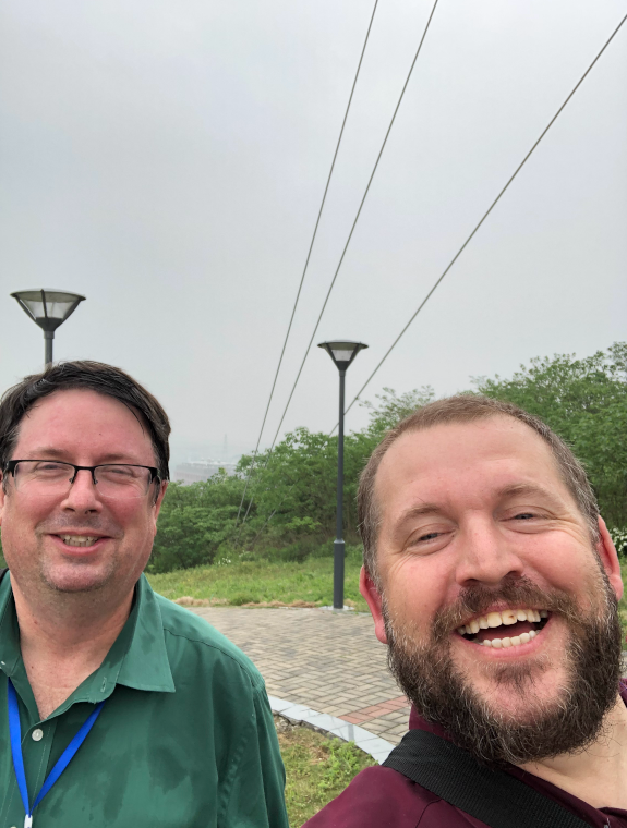 Scott Collis takes a snapshot with Michael Jensen while in Nanjing, China.