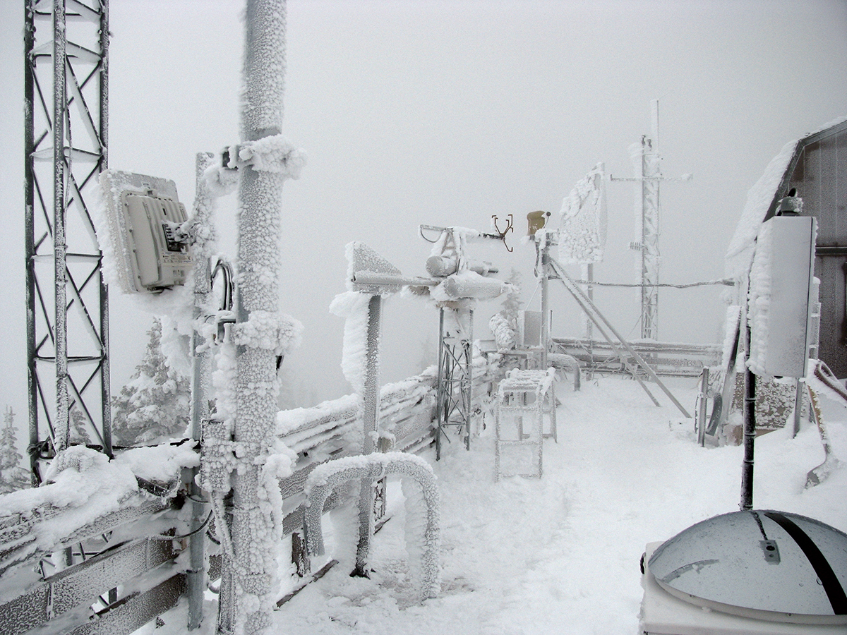 Frost-covered ARM instruments sit within cloud cover high in the Rocky Mountains.