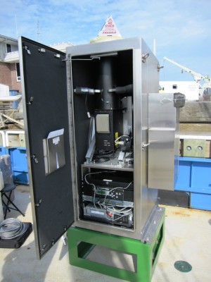 Shown here during installation on the aft deck of the RV Connecticut, the upgraded MPL includes a sleek new computer that can fit into smaller spaces. The laser window at the top is covered by a cone until the instrument is turned on. ARM file photo. 