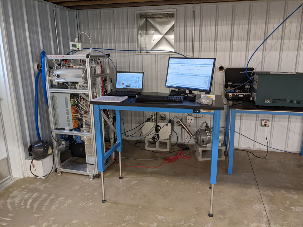 Computer equipment is set up on tables and shelves inside the Guest Instrument Facility at ARM's Southern Great Plains Central Facility.