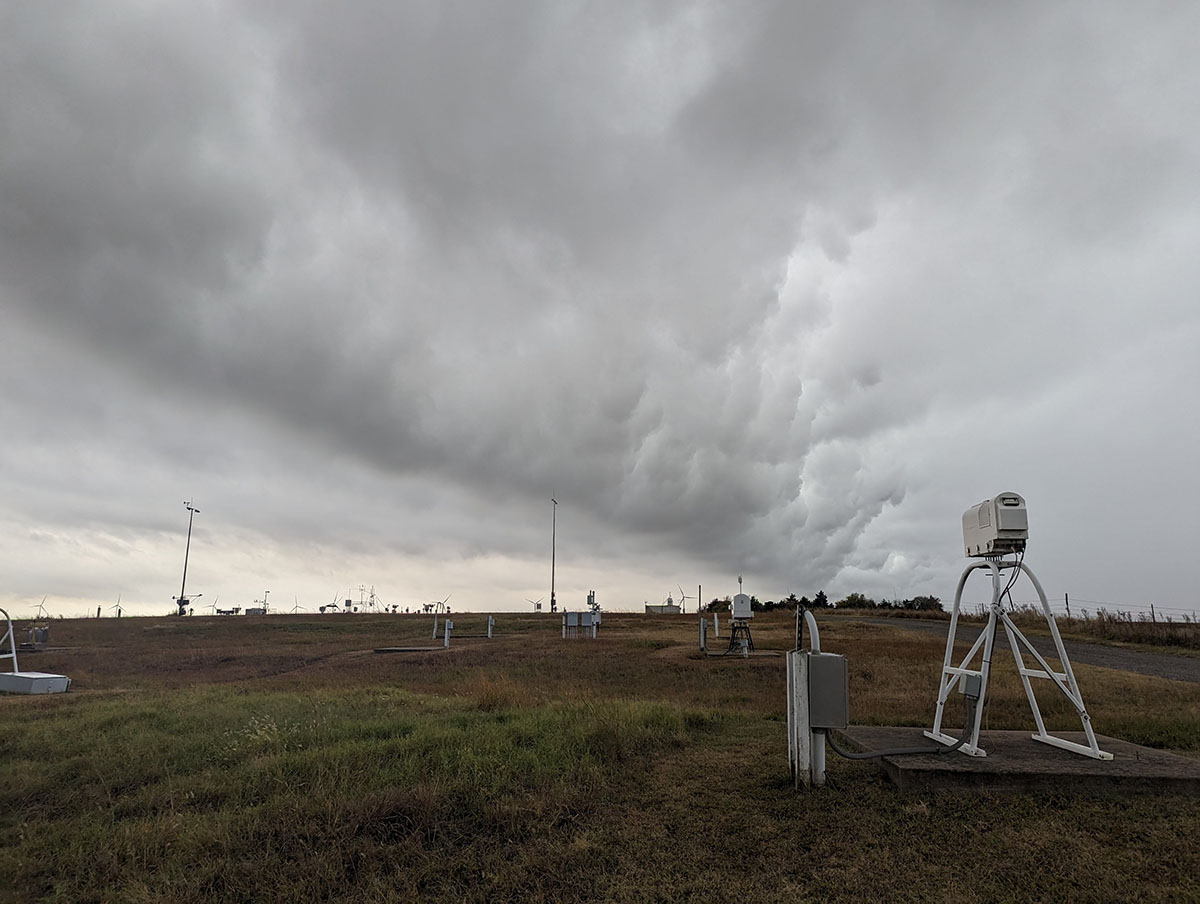 Clouds roll above an ARM instrument field.