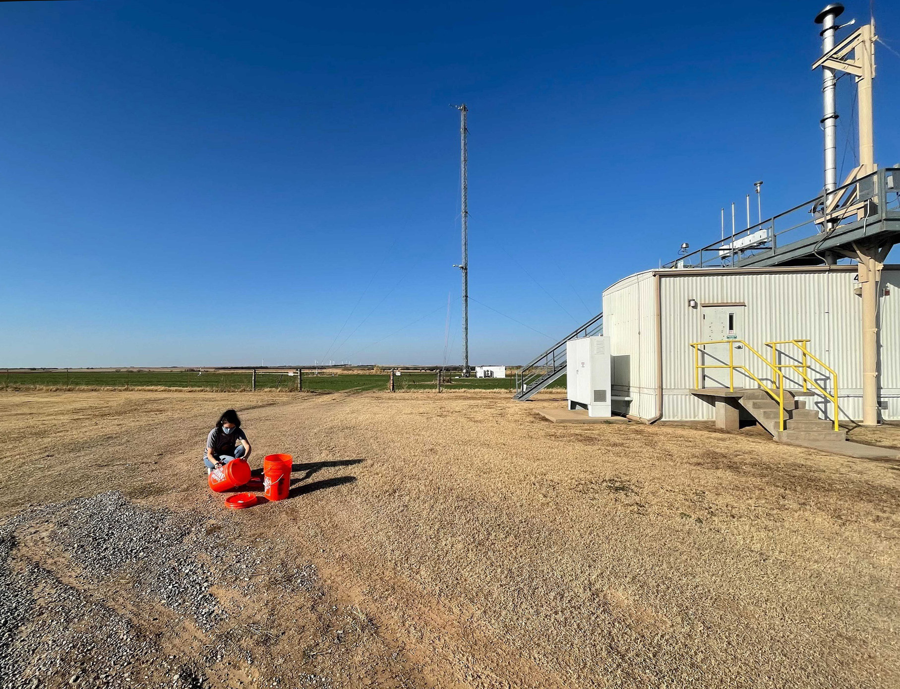 Kimberly Sauceda, a graduate student at West Texas A&amp;M University, collects soil samples at ARM's Southern Great Plains observatory.