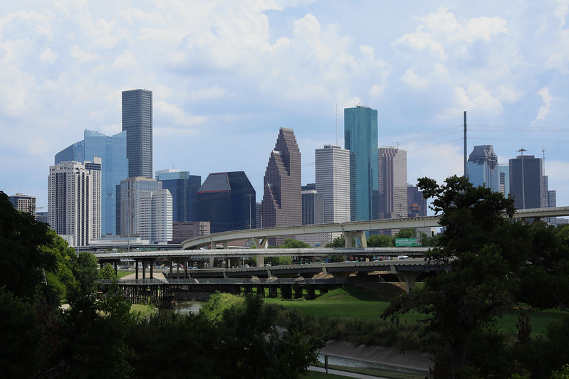 Freeways criss-cross in front of the downtown Houston skyline.