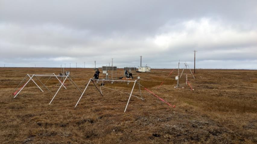 Instruments stand on an expanse of tundra.