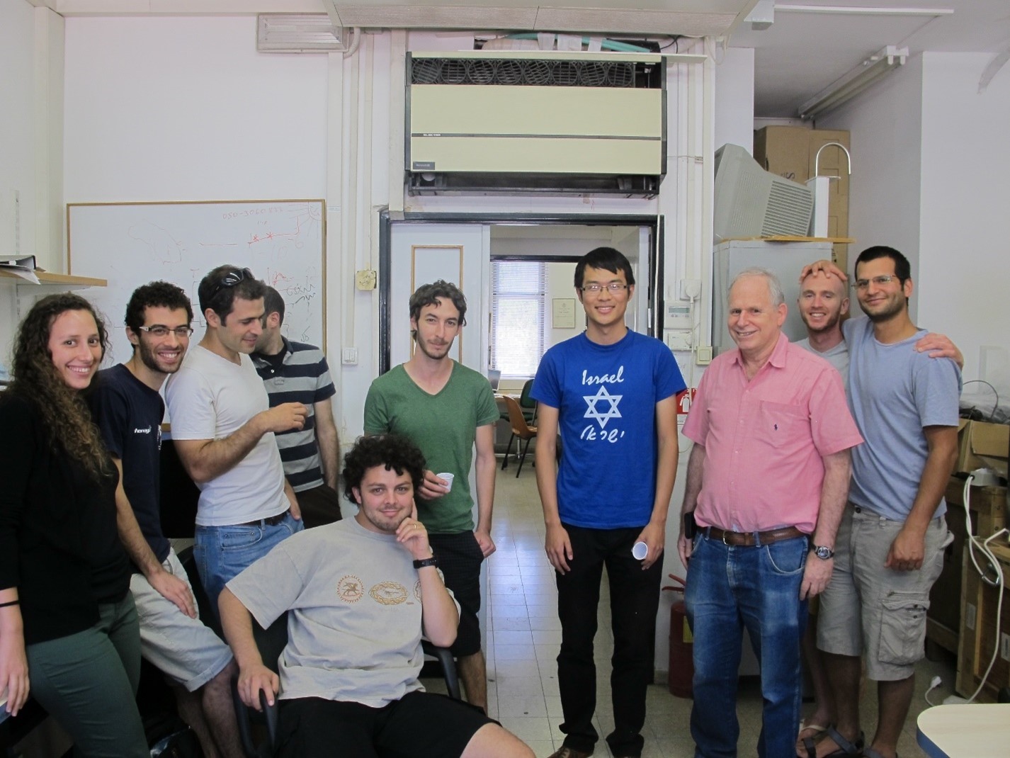 Youtong Zheng poses among a group of friends at his farewell party.