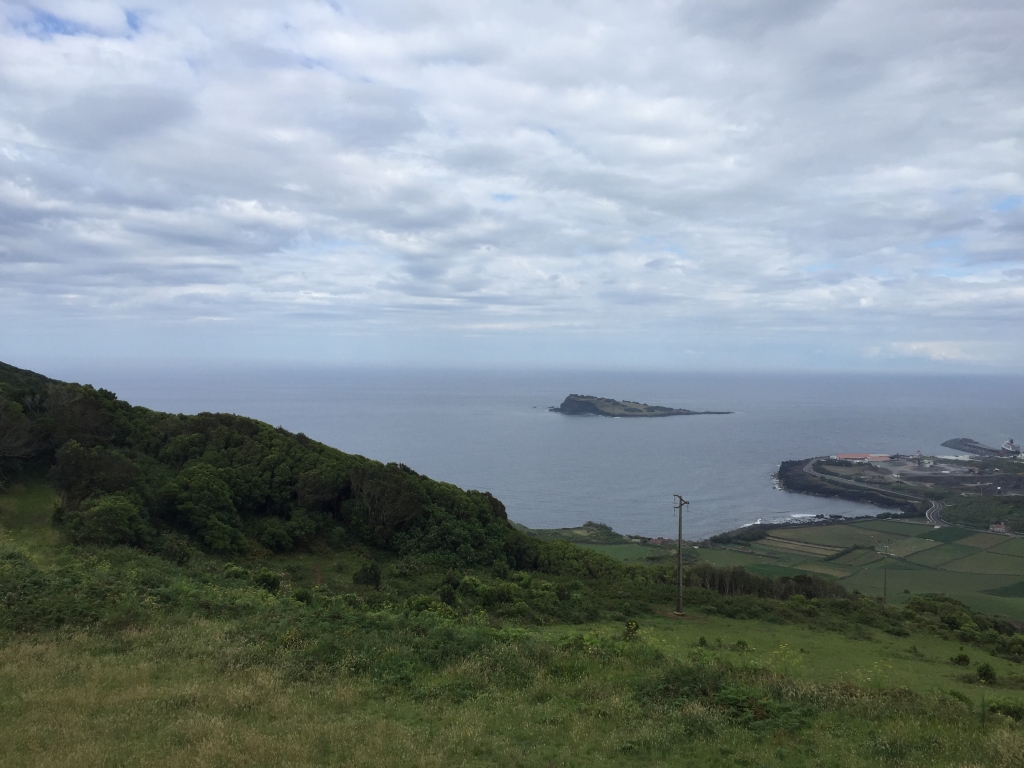 Drizzling clouds appear over the Atlantic Ocean and Graciosa Island.