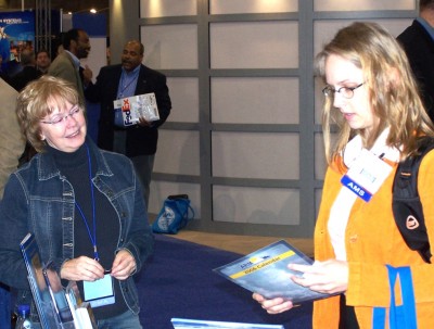 Nancy Burleigh, left, shared her considerable knowledge about the ARM Program with visitors to the ARM exhibit at numerous conferences throughout the years. ARM file photo.