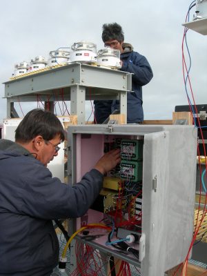 Walter Brower (left) and Jimmy Ivanhoff (right) work on radiometric instruments at the North Slope of Alaska's Barrow observatory.