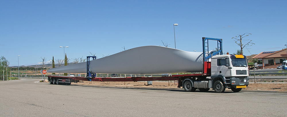 Transportation of a wing of the wind turbine by truck on roads of Spain
