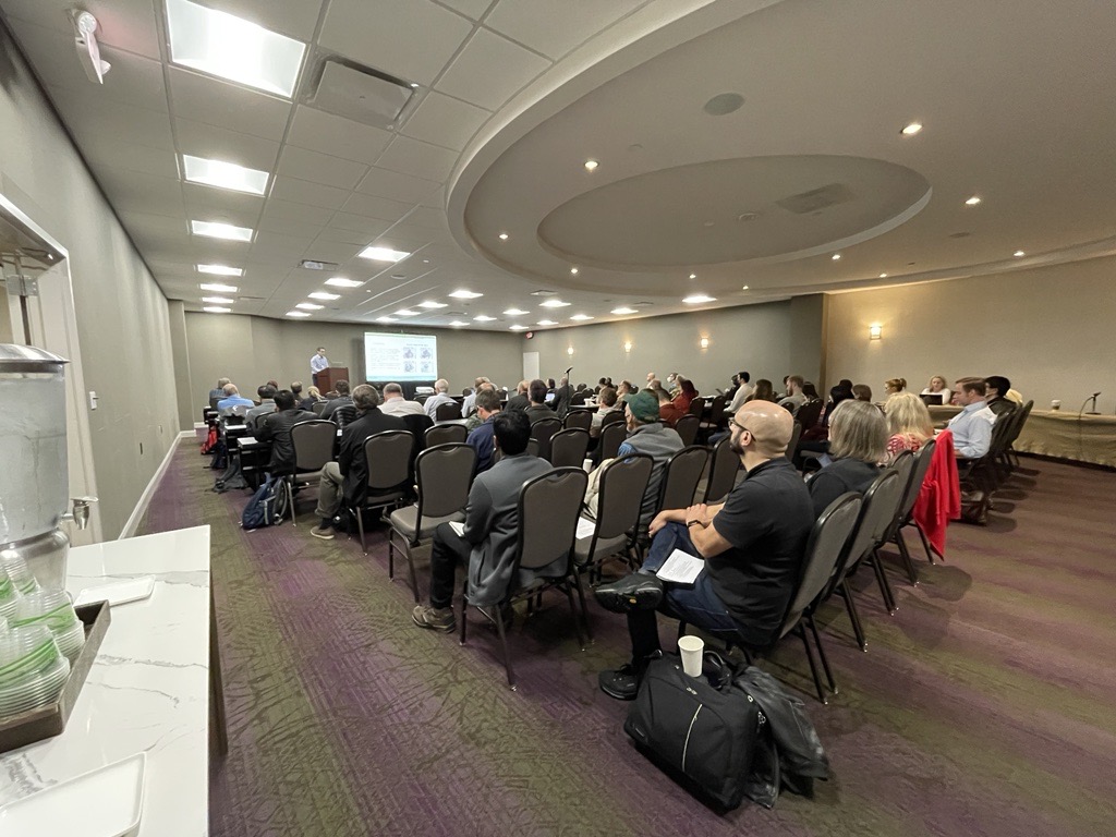 People sit in a conference room listening to a presenter at the podium during the 2022 ARM/ASR joint meeting.