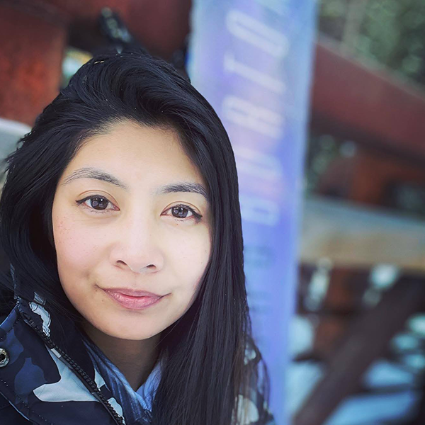 Desiree Sarmiento looks straight at the camera.